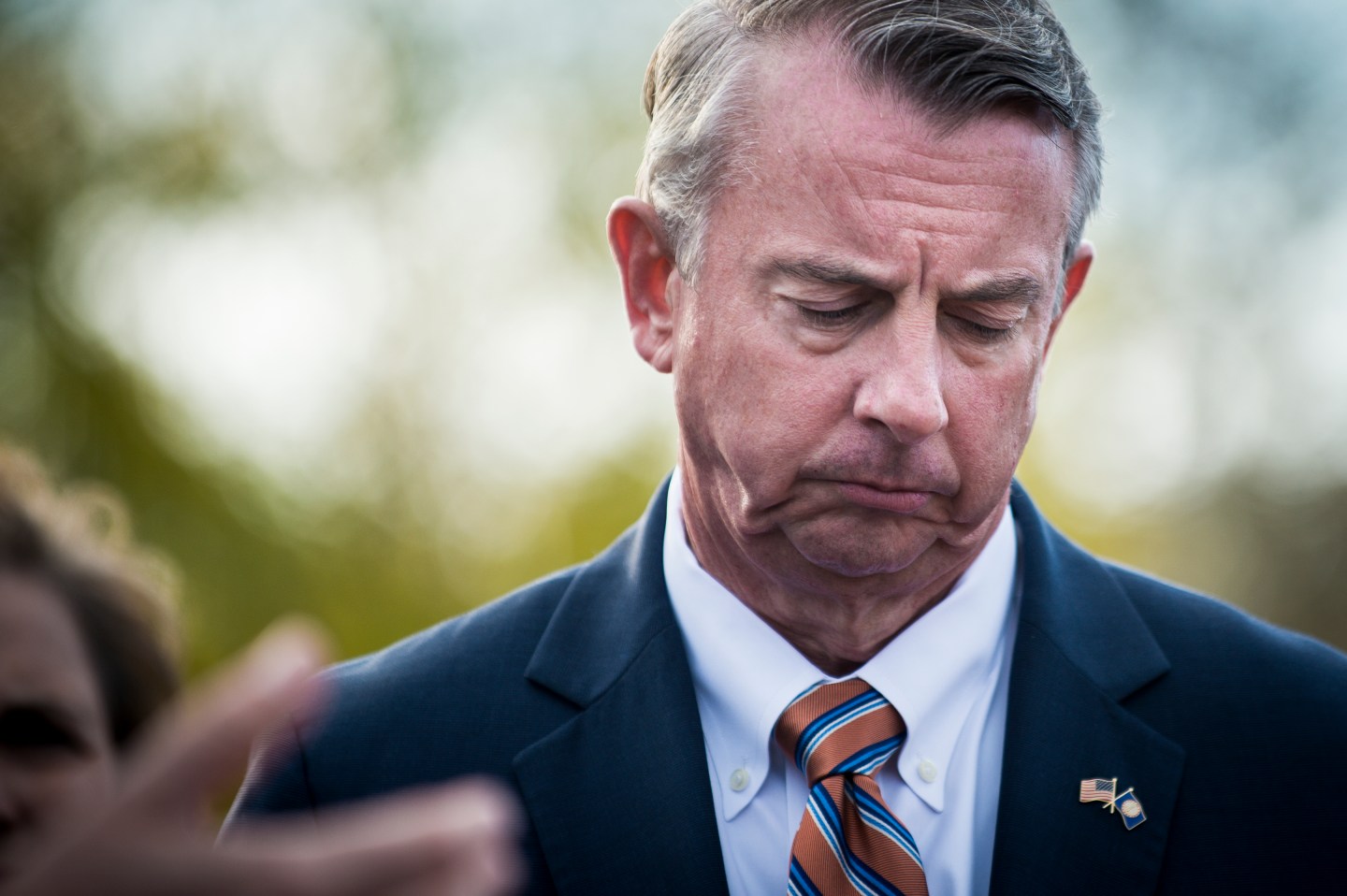 Ed Gillespie looks down and appears sad