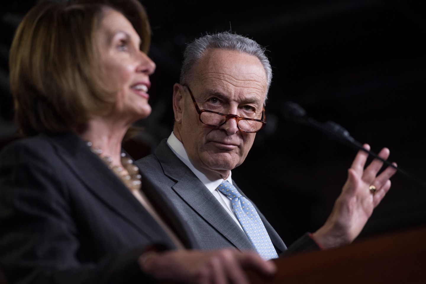 Nancy Pelosi and Chuck Schumer speaking at a press conference