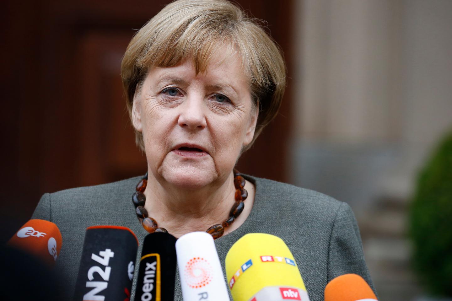 German Chancellor Merkel arrives for exploratory talks at the German Parliamentary Society about forming a new coalition government in Berlin