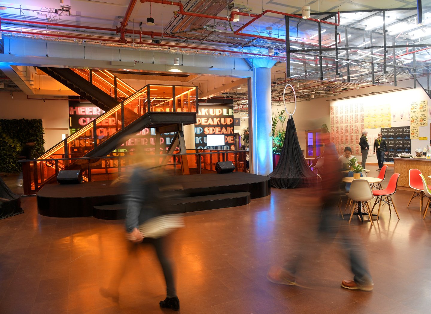 People walk through the lobby at Facebook's headquarters in London