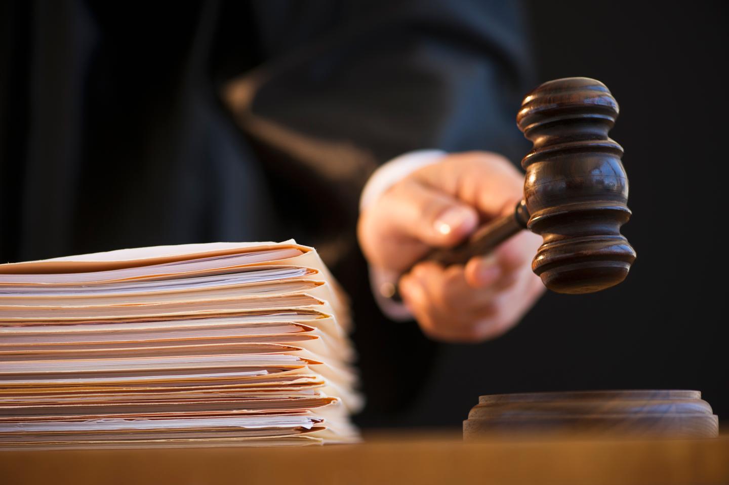 Judge holding gavel, close-up