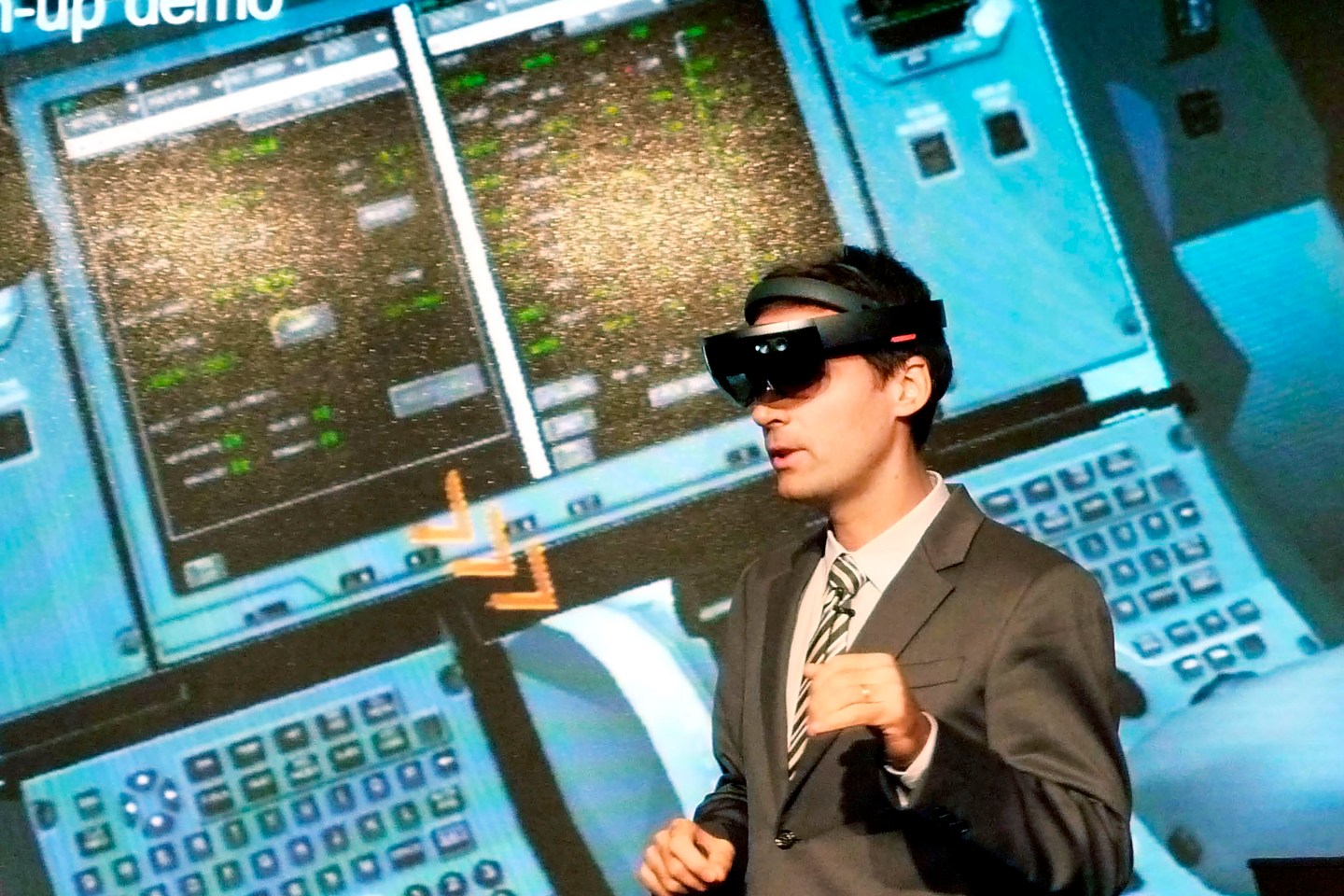 An Airbus staffer views a cockpit with VR.