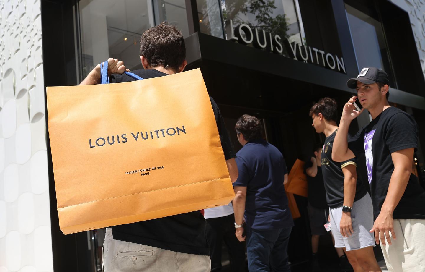 Crowds Line Up For Limited Edition Supreme And Louis Vuitton Collaboration Clothing Items