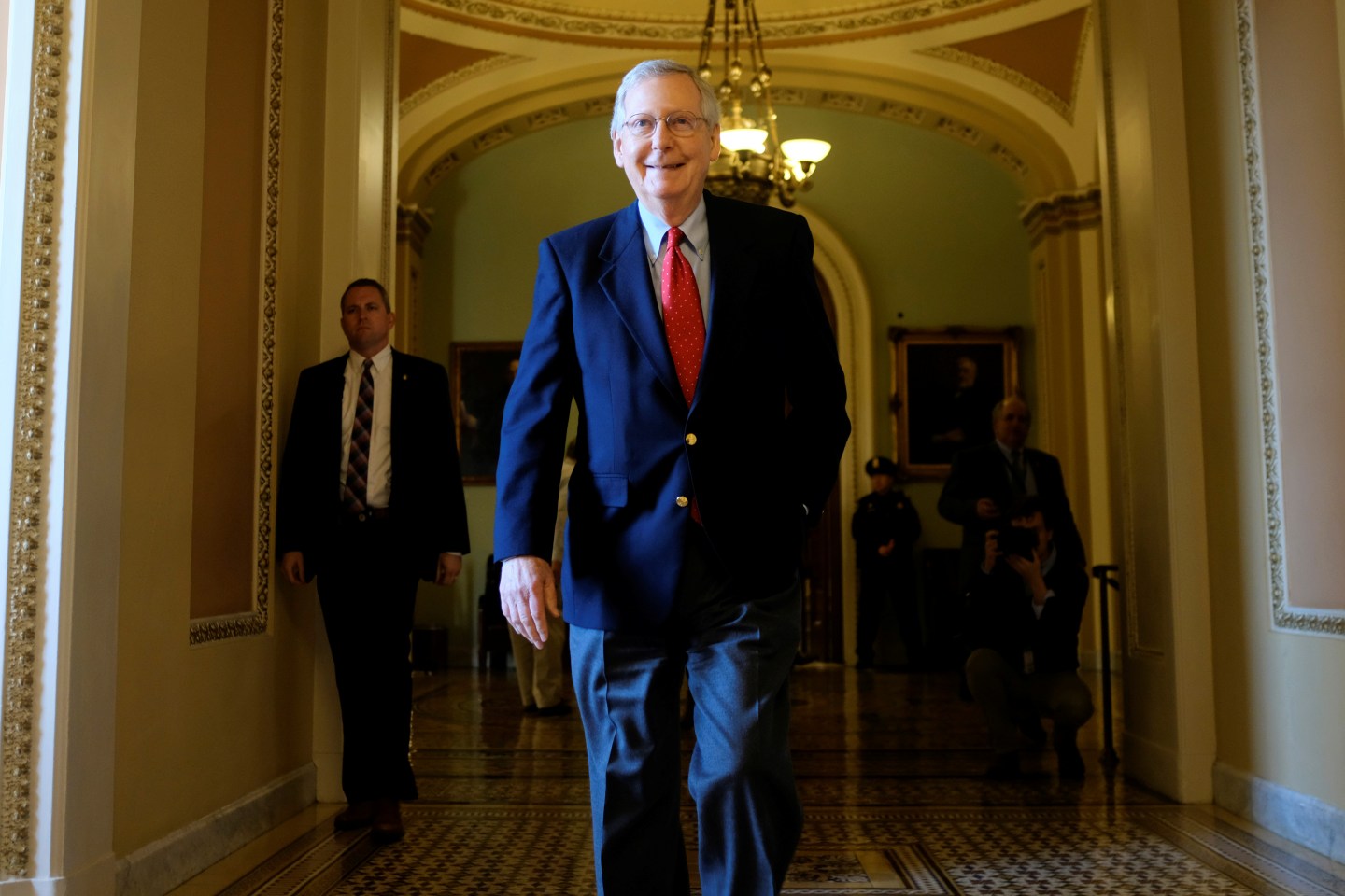 U.S. Senate Majority Leader McConnell leaves the Senate floor during debate over the Republican tax reform plan in Washington