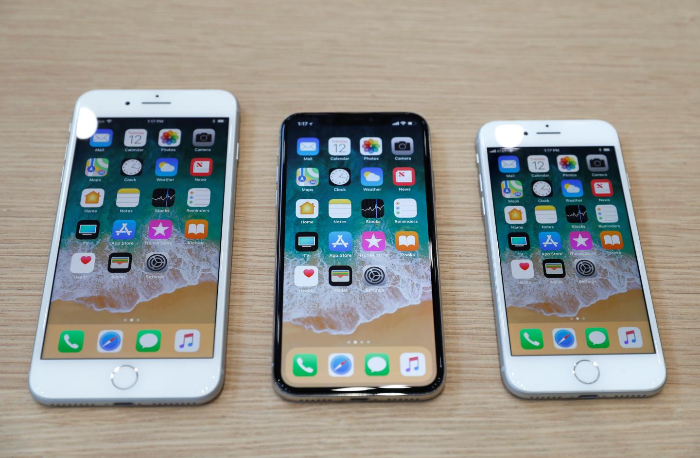 Different iPhone 8 models are displayed during an Apple launch event in Cupertino