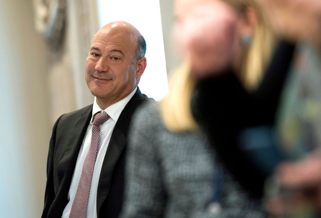 WASHINGTON, D.C. - OCTOBER 19: (AFP-OUT) Gary Cohn, Director of the National Economic Council, listens as President Donald Trump speaks with Governor Ricardo Rossello of Puerto Rico during a meeting in the Oval Office at the White House on October 19, 2017 in Washington, D.C. Trump and Rossello spoke about the continuing recovery efforts following Hurricane Maria. (Photo by Kevin Dietsch-Pool/Getty Images)