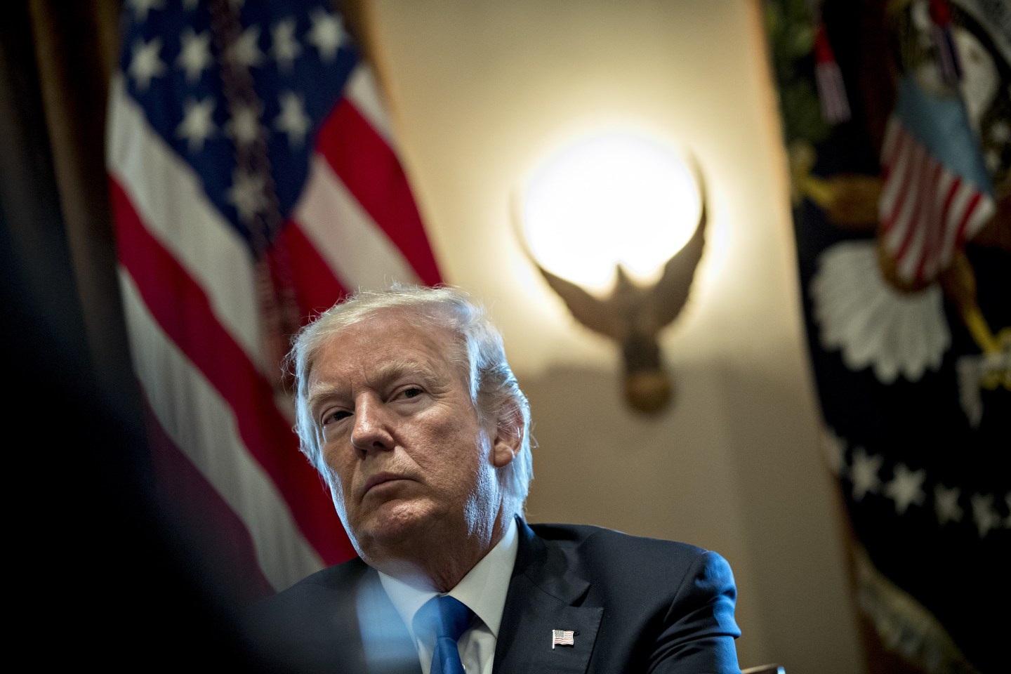U.S. President Donald Trump listens during a meeting with bipartisan members of Congress on immigration in the White House in Washington, D.C., U.S., on Tuesday, Jan. 9, 2018.