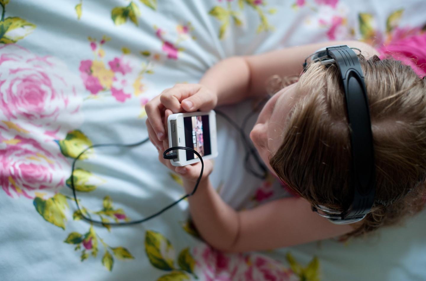 Girl watching her smartphone