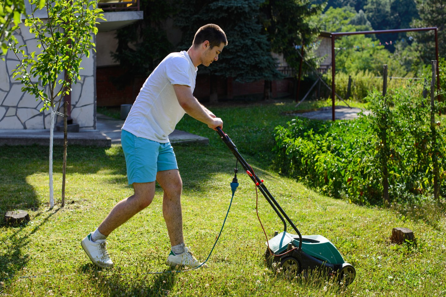 Teen Mowing Lawn