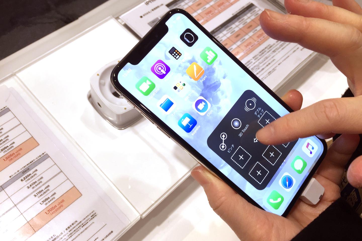 Apple's new iPhone X is displayed after it goes on sale at the Apple Store in Tokyo
