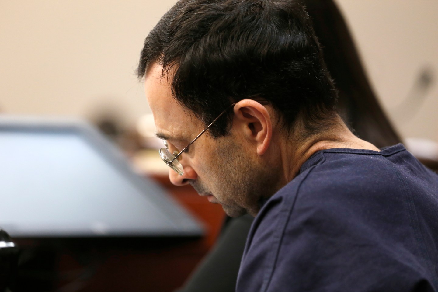 Former Michigan State University and USA Gymnastics doctor Larry Nassar looks down while listening to victim statements during the sentencing phase in Ingham County Circuit Court on January 24, 2018 in Lansing, Michigan.