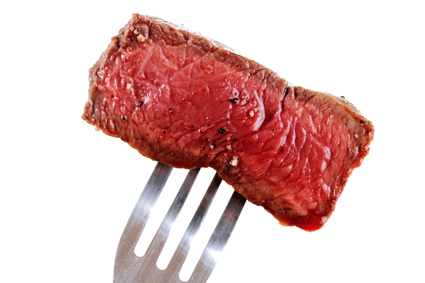Piece of beef filet on fork, close-up