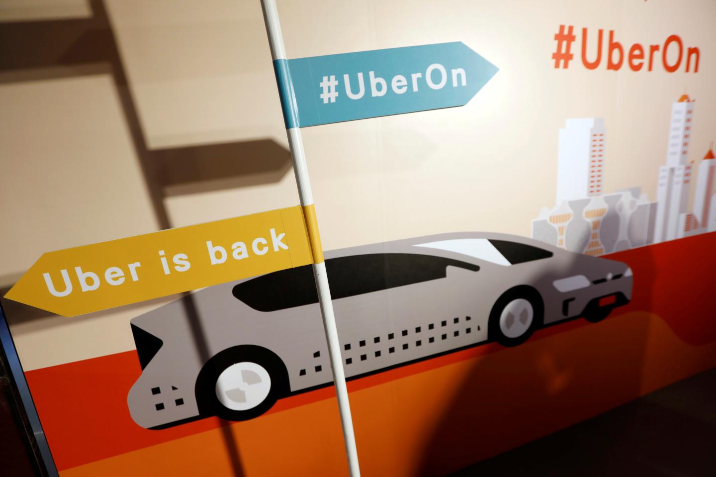 A sign is seen during a news conference to announce Uber resumes ride-hailing service, in Taipei
