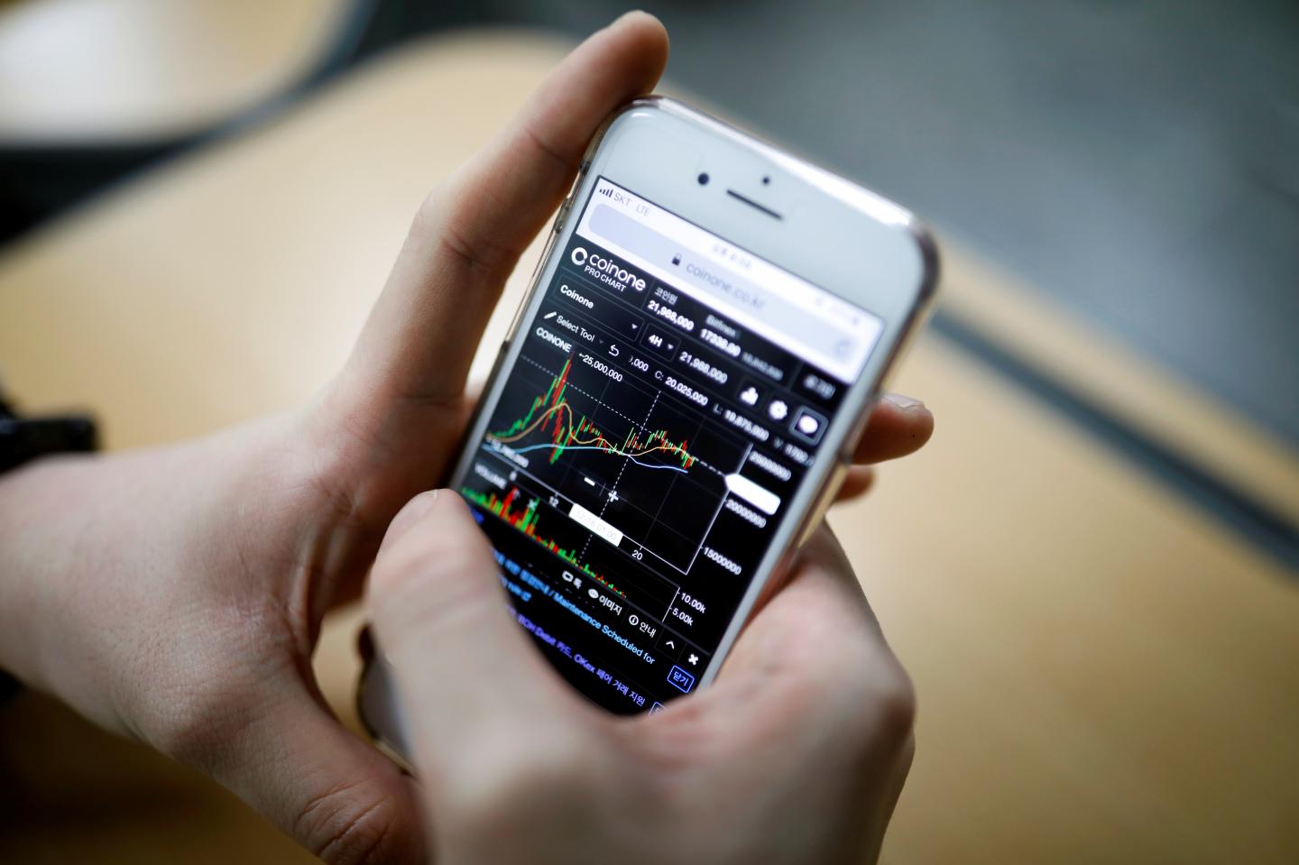 Eoh Kyung-hoon, leader of a club studying cryptocurrencies, checks a chart after a meeting at a university in Seoul