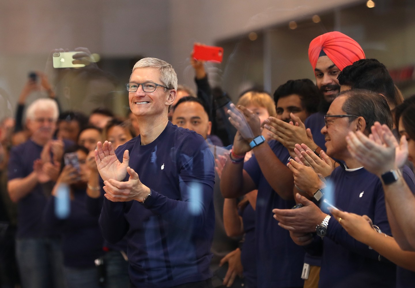 Apple CEO Tim Cook prepares to greet customers that will purchase a new iPhone X at an Apple Store on November 3, 2017 in Palo Alto, California.