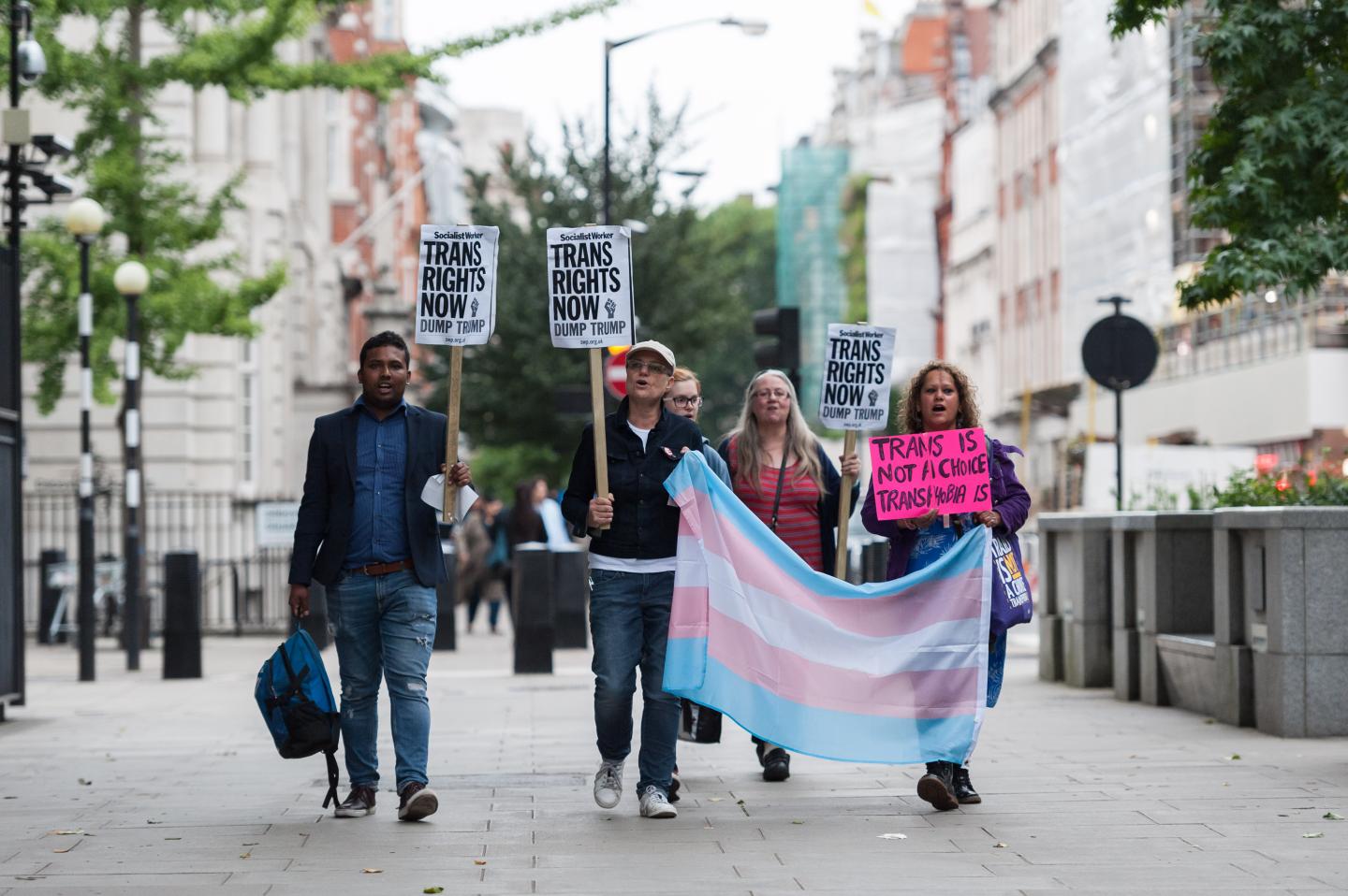 A group of demonstrators gather in front of the U.S. Embassy to protest against Donald Trump's latest announcement that transgender troops will not be allowed to serve in any capacity in the US military on July 28, 2017 in London, England.