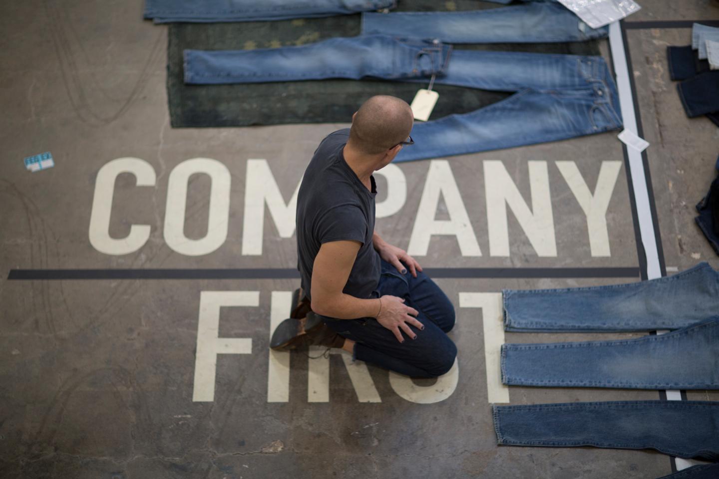 Bart Sights, VP of technical innovation at Levi Strauss, inspects jeans on the floor of his Eureka Innovation Lab in San Francisco