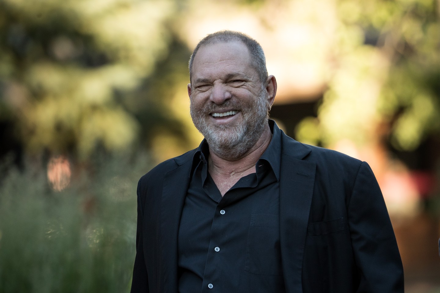 Harvey Weinstein appears smiling at a meeting in Sun Valley, Idaho