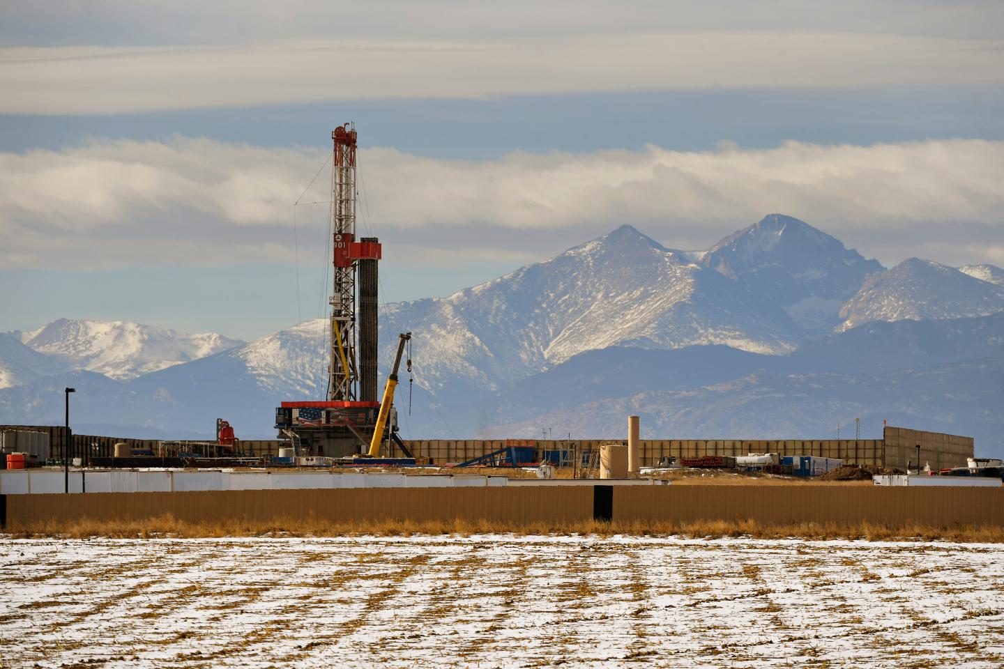 A large fracking operation with mountains looming in the background on December 28, 2017 in Loveland, Colorado.