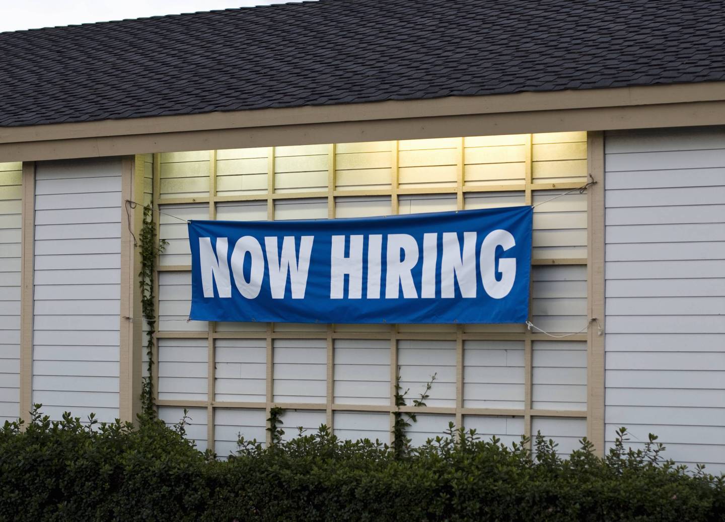 A NOW HIRING sign