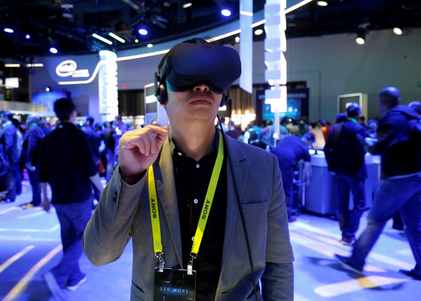 Summer Tan of China tries out a Oculus Rift virtual reality headset at the Intel booth during the 2017 CES in Las Vegas