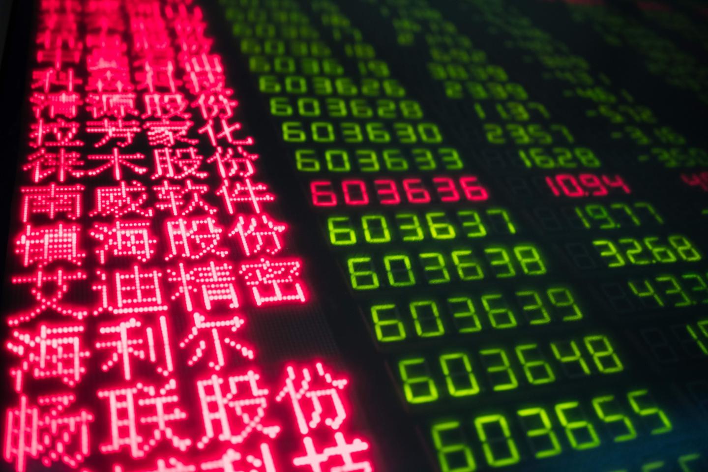 Stock price movements on a screen at a securities company in Beijing on March 23, 2018.