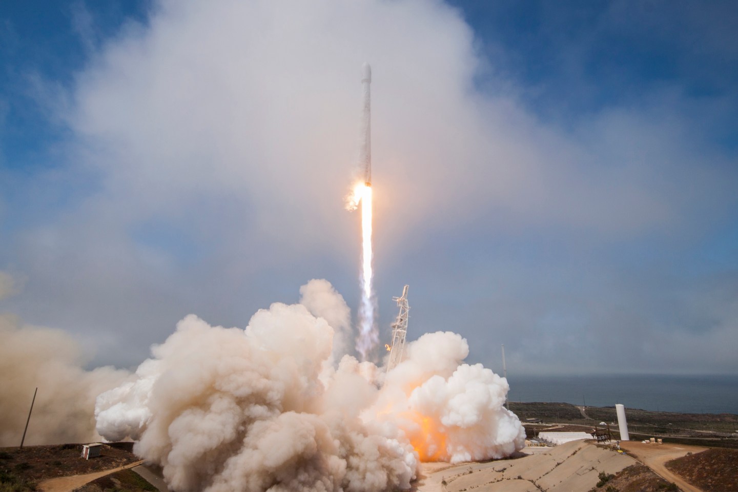 Falcon 9 SpaceX rocket launches from its stand