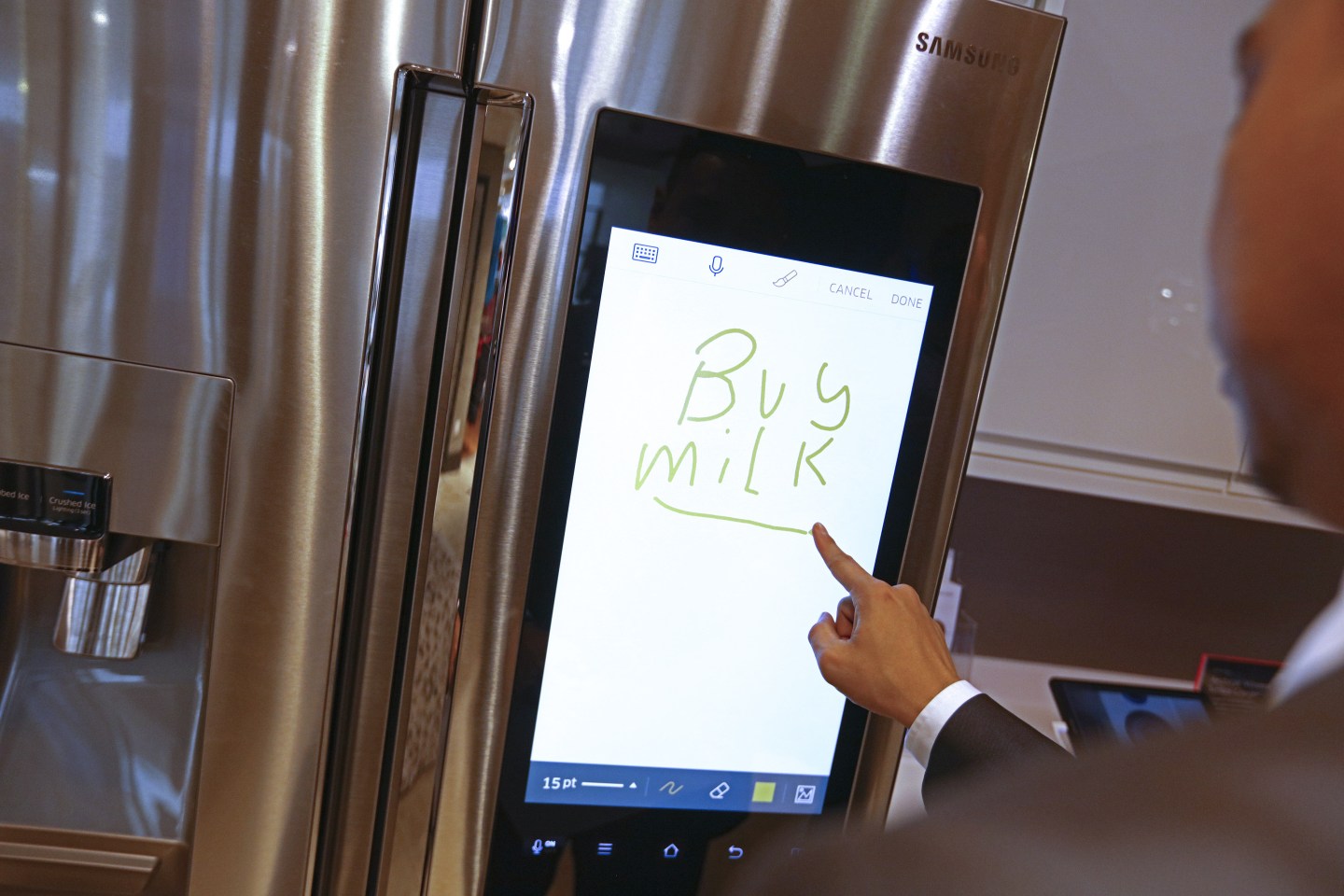 Customer write 'buy milk' on a smart refrigerator in a U.K. department store