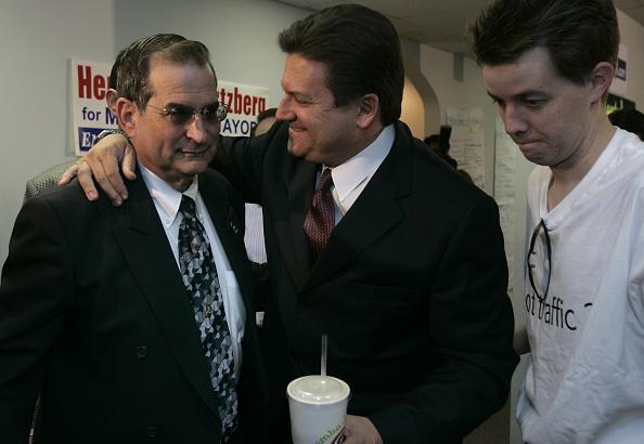 Encino, Ca. Los Angeles mayoral candidate Bob Hertzberg, center, hugs long time friend Rickey Gel