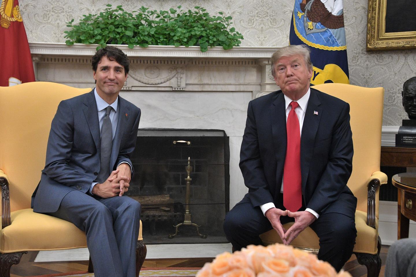 Donald Trump and Justin Trudeau sit side-by-side at the White House
