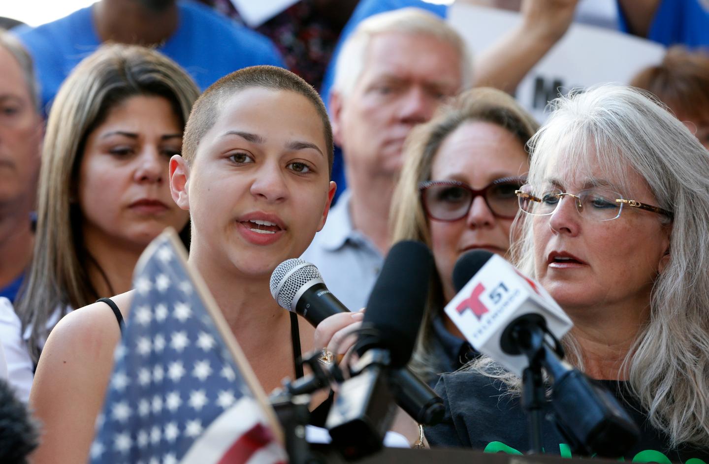 Marjory Stoneman Douglas High School student Emma Gonzalez speaks into microphone at gun control rally