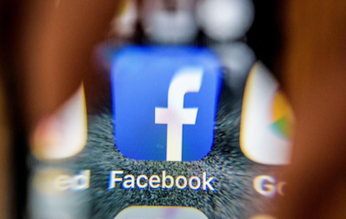 Facebook logo on smartphone
