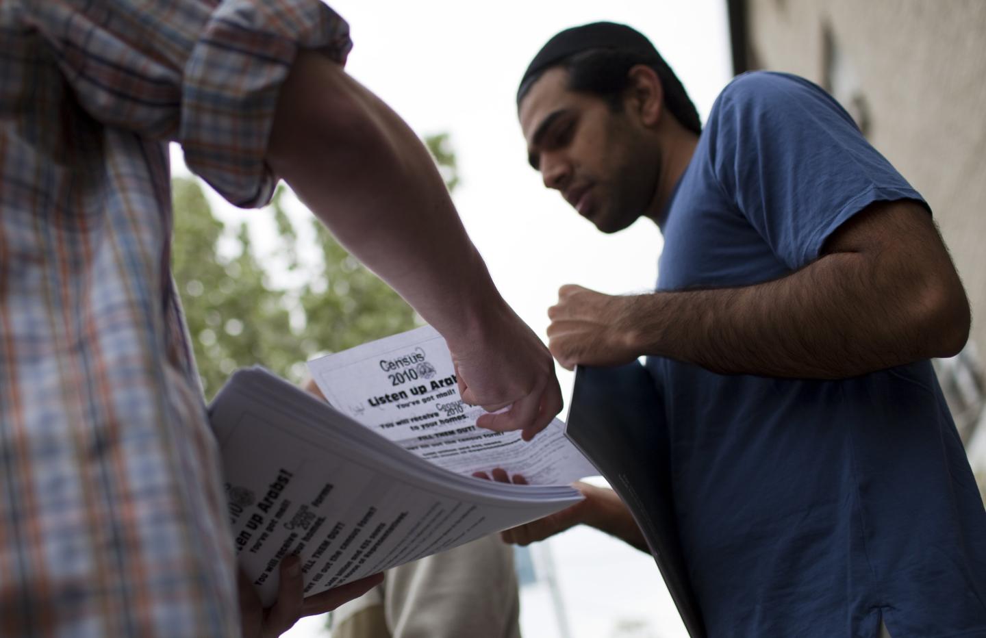 Man holds census forms amid outreach to Arab Americans