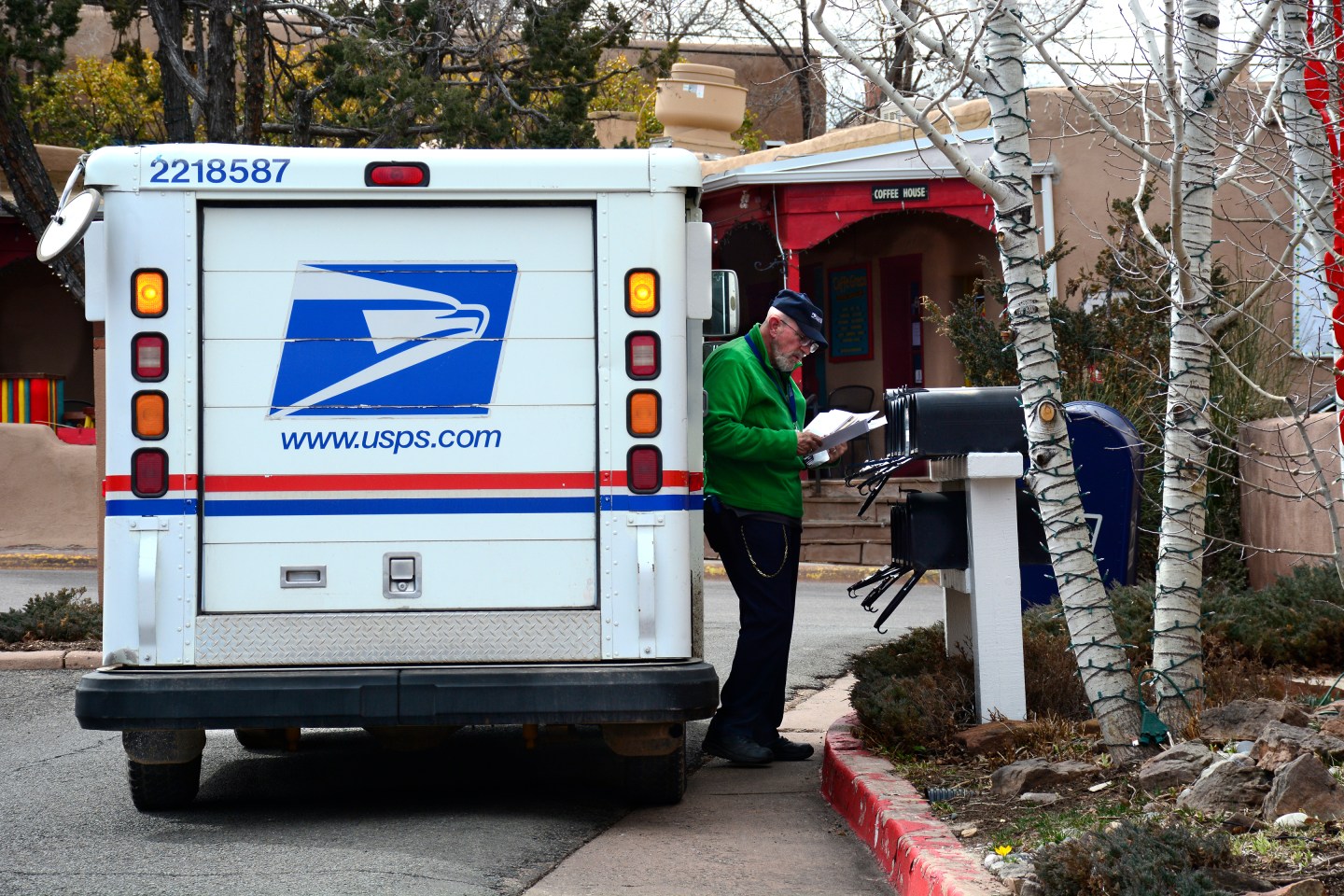 USPS worker delivering mail