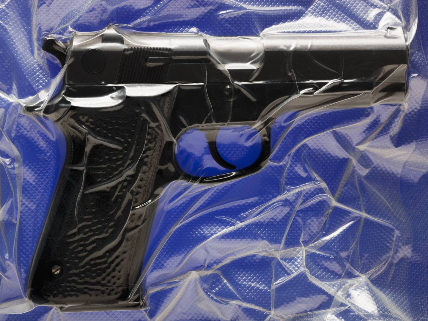 Shrink wrapped hand gun