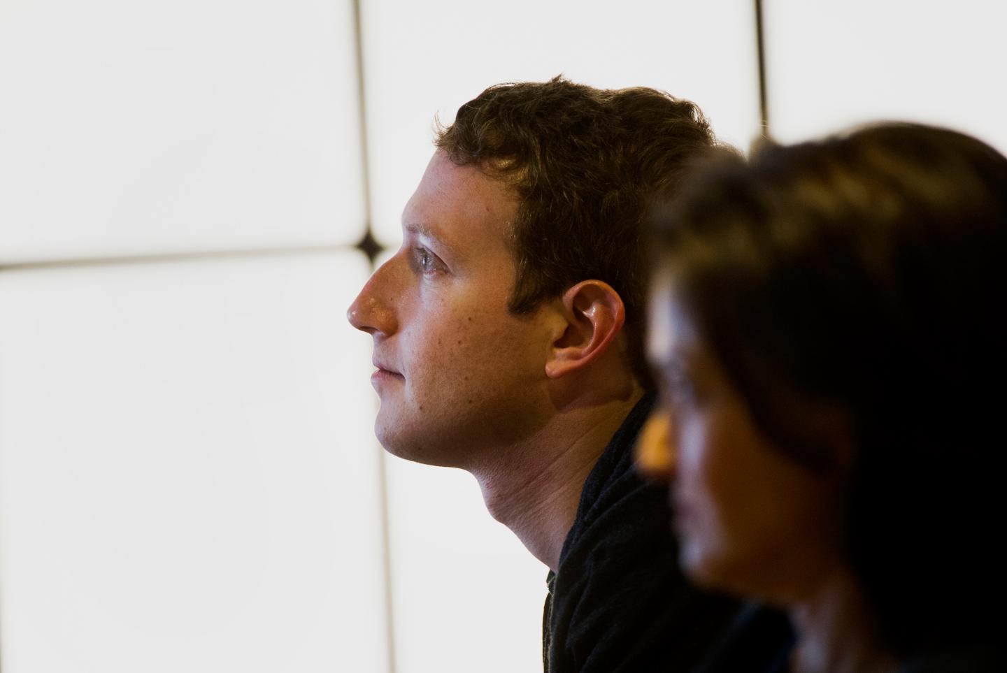 Facebook CEO Mark Zuckerberg and COO Sheryl Sandberg watch a presentation at the company's headquarters in Menlo Park, California.