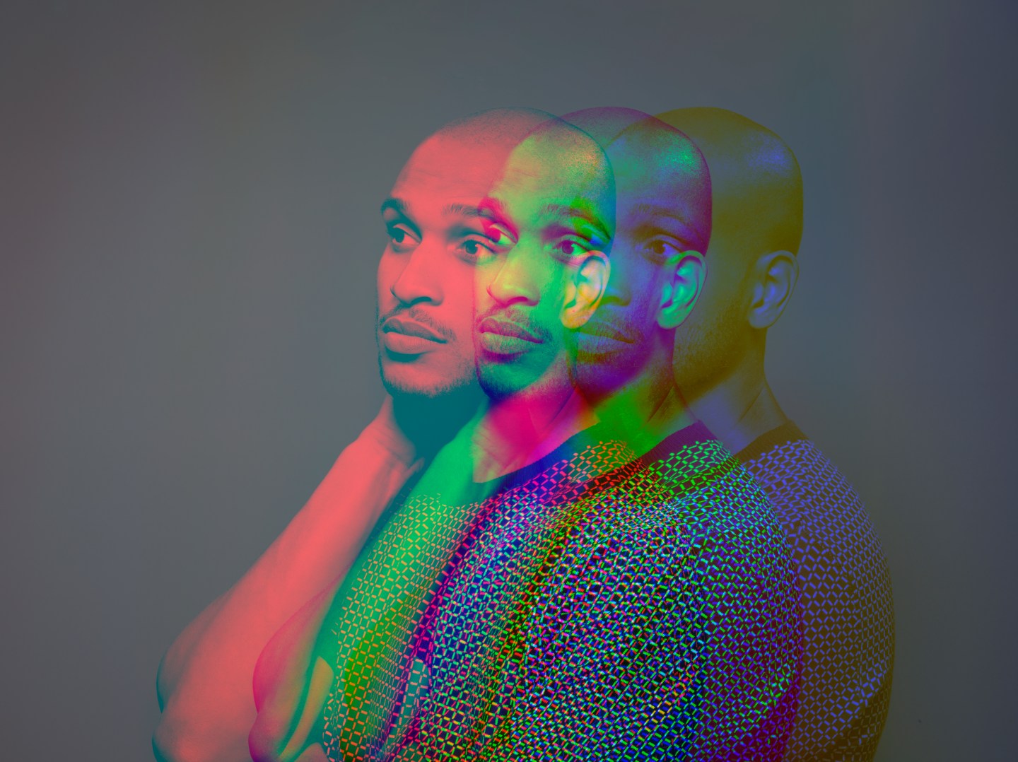 Multiple exposure, portrait of a dark skinned man who looks concerned