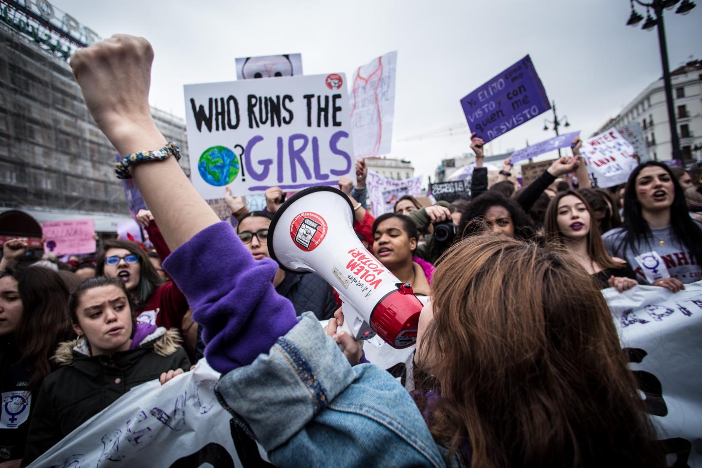 A demonstrator chants over a megaphone during a one day strike to defend women's rights on International Women's Day in Madrid, on March 8, 2018.