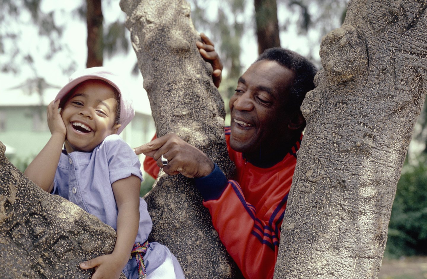 Bill Cosby as Dr. Heathcliff 'Cliff' Huxtable and Keshia Knight Pulliam as Rudy Huxtable on the Cosby Show.