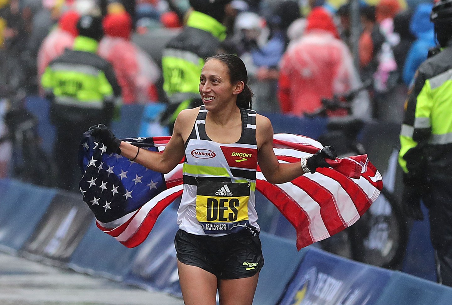 2018 Boston Marathon winner Desi Linden with American flag