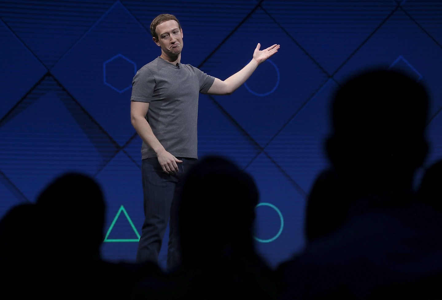 Mark Zuckerberg gestures while onstage