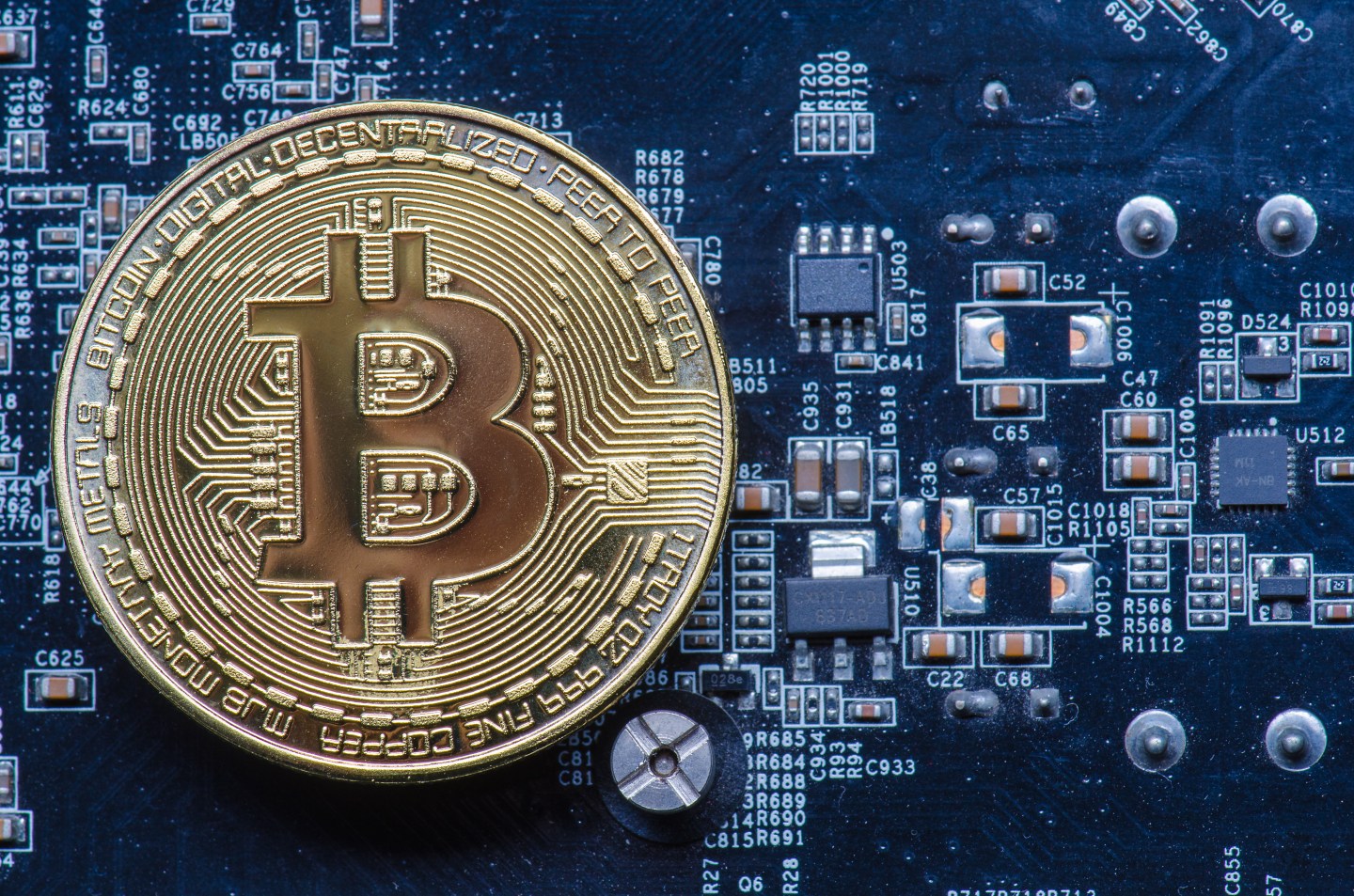 Close-Up View Of Bitcoin On Mother Board