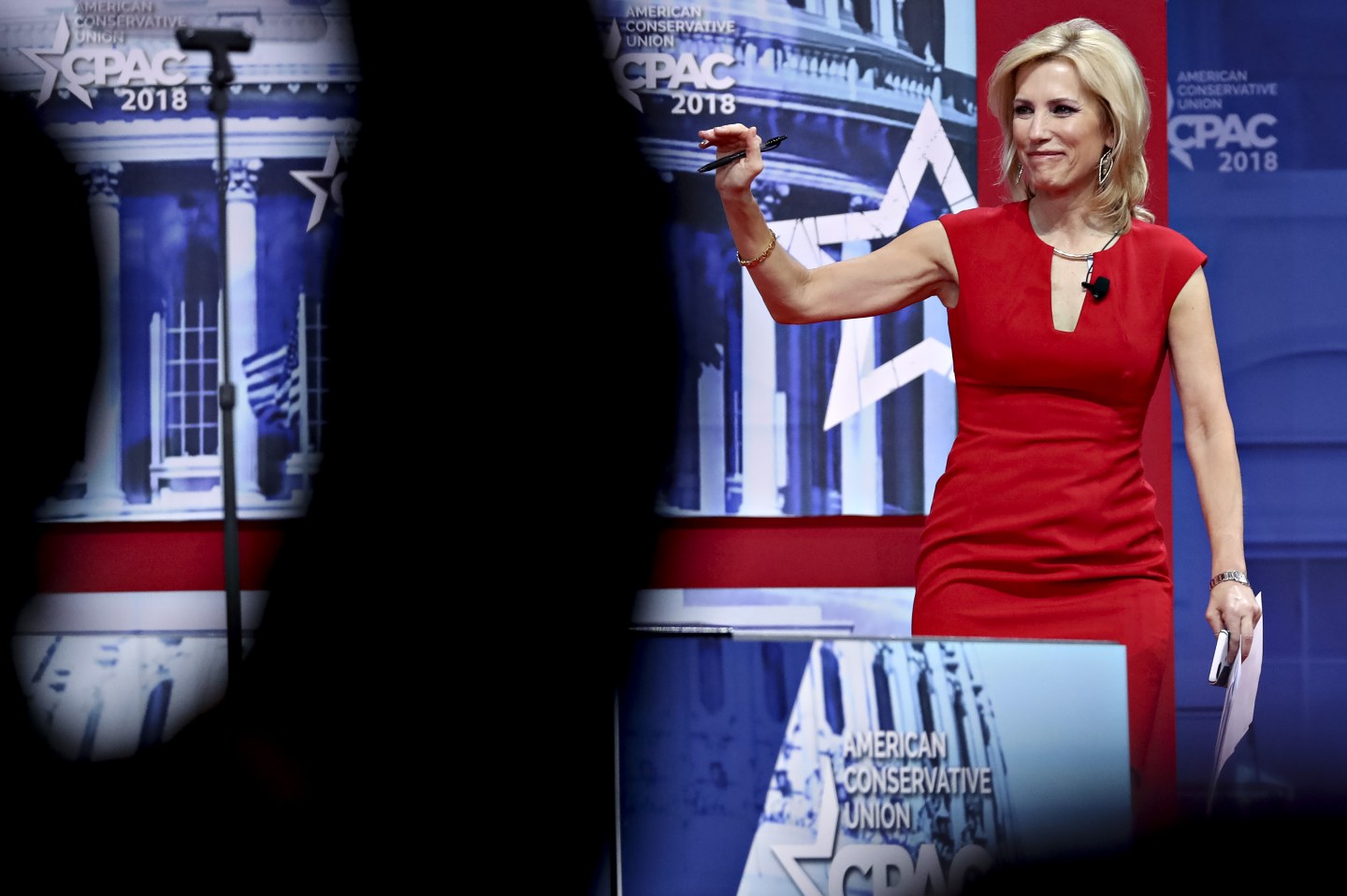 Laura Ingraham appears on-stage at CPAC, waves to crowd