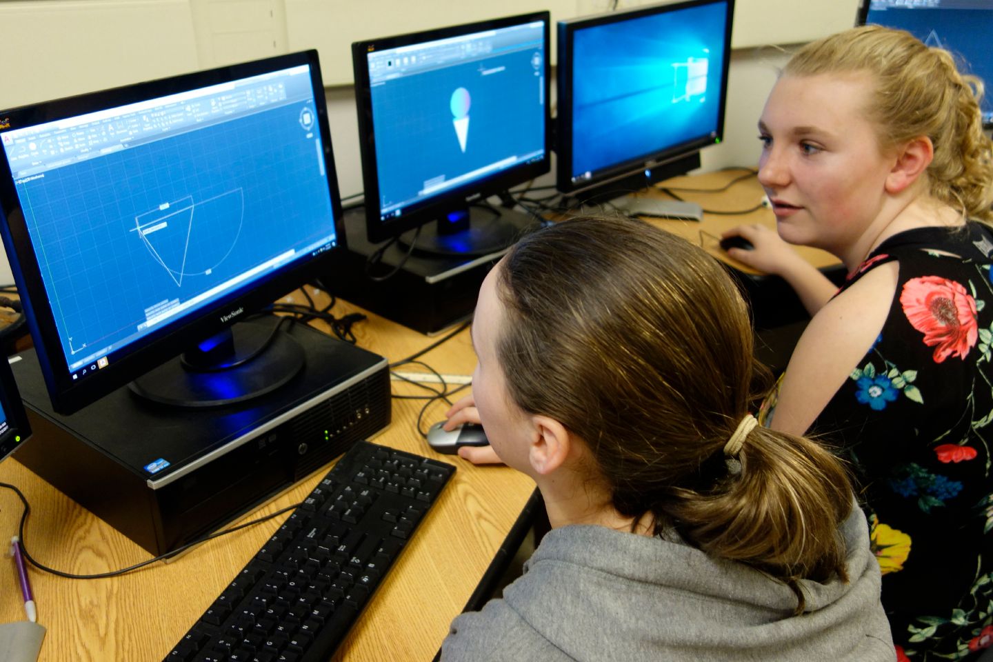 6th Grade Girls Using CAD Program to Design a Fidget Widget