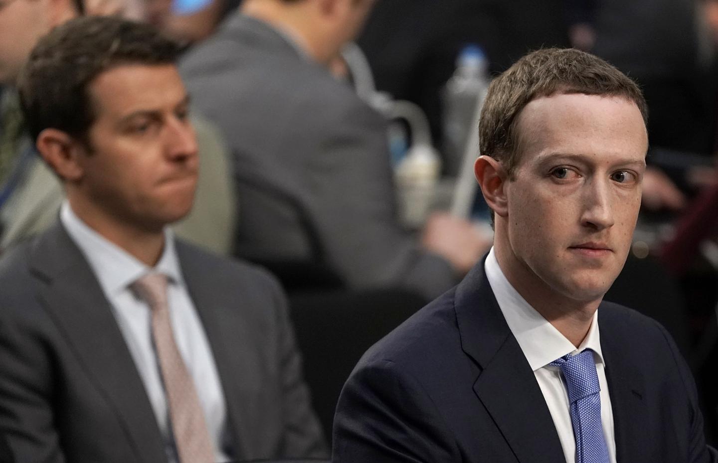 Facebook CEO Mark Zuckerberg glances sideways during Senate testimony.
