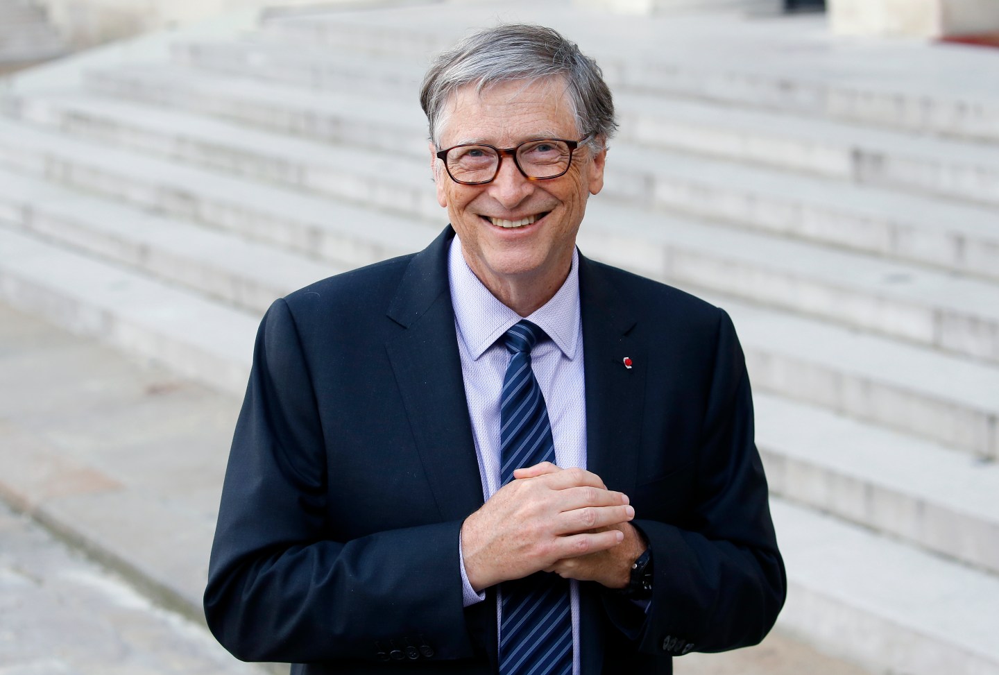 Bill Gates photographed on staircase as he meets with Emmanuel Macron