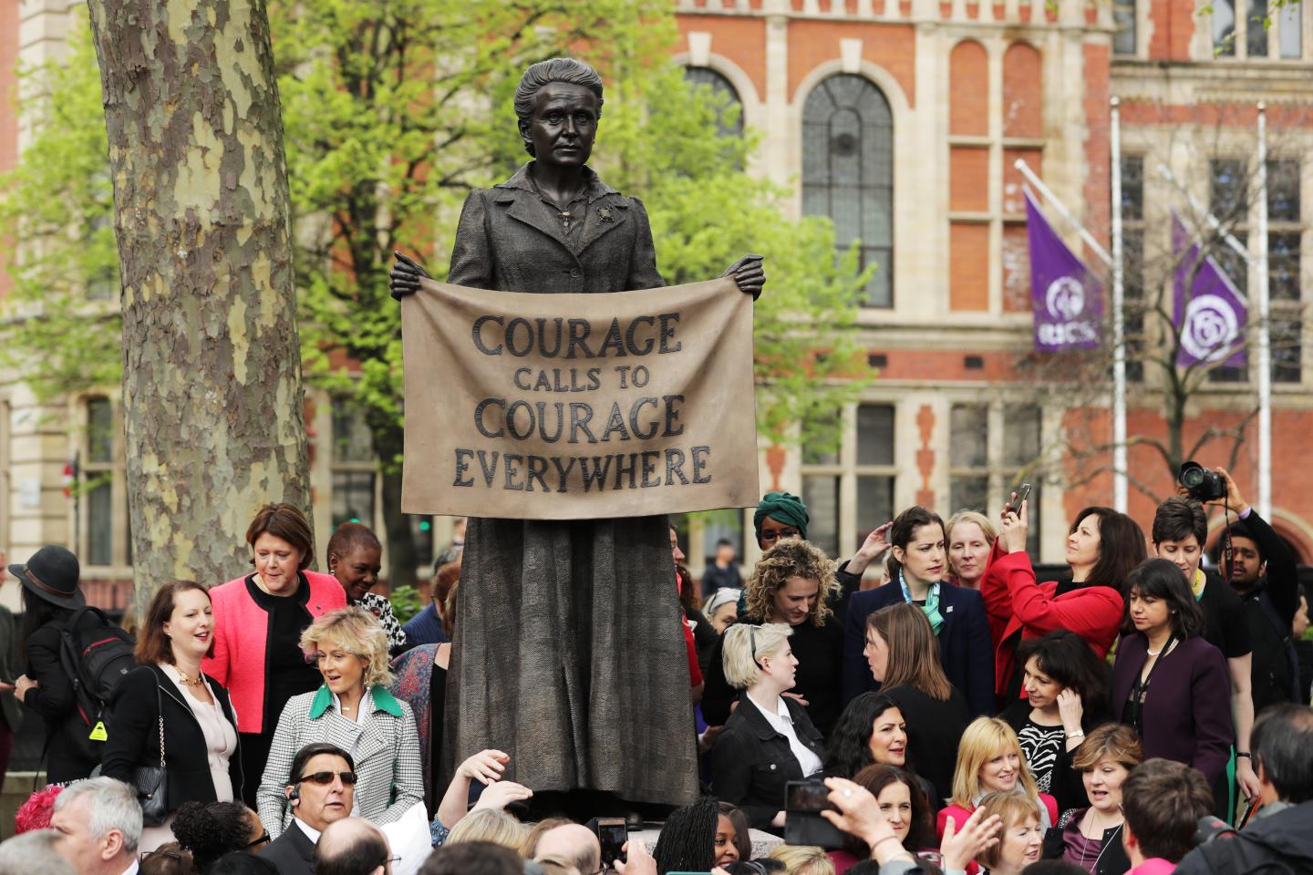Crowd stands around news statue of Millicent Fawcett in Parliament Square in London