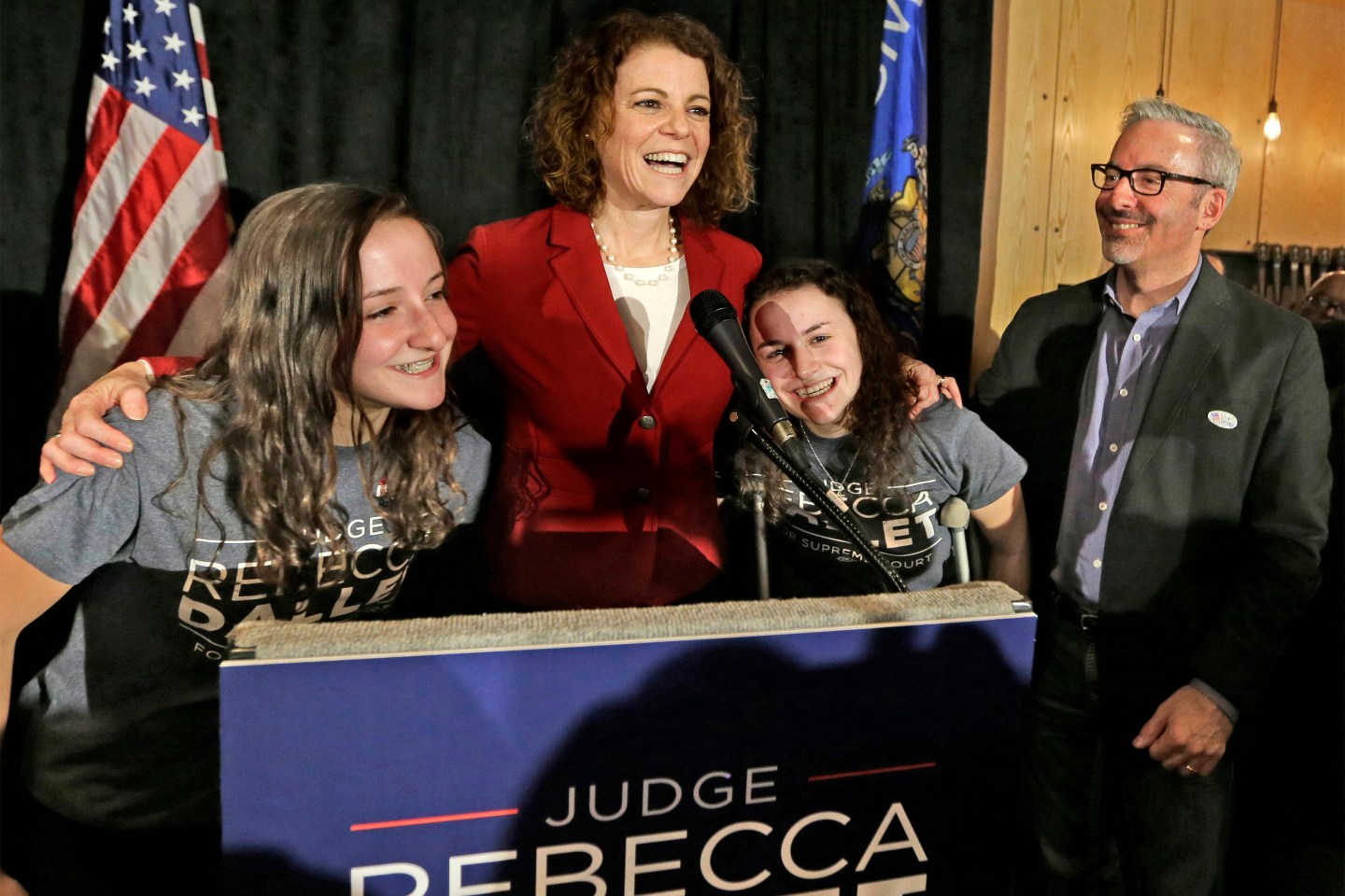 Rebecca Dallet, with her two daughters, on stage on Tuesday.