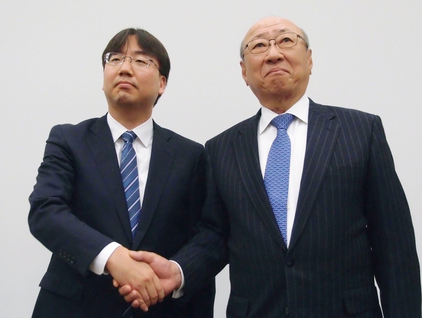 New Nintendo President Shuntaro Furukawa shakes hand with Tatsui Kimishima