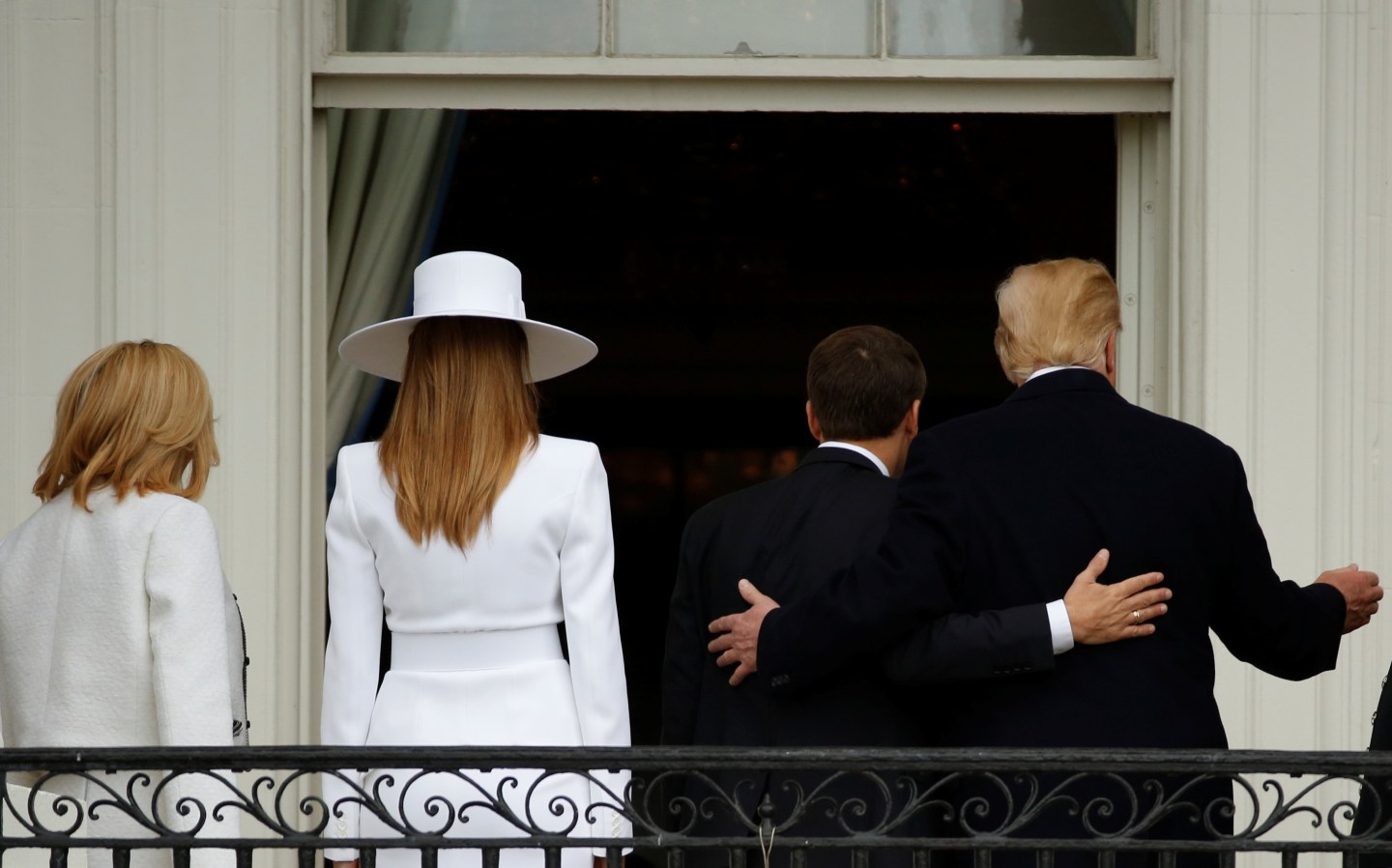 U.S. President Donald Trump and first lady Melania Trump welcome French President Emmanuel Macron and his wife Brigitte Macron during an arrival ceremony at the White House in Washington